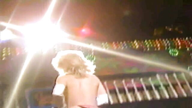Blonde twink in red thong bareback on stage with pyrotechnics
