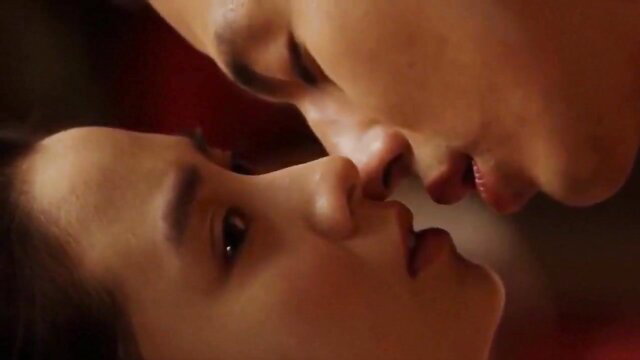 Asian couple close-up kiss, intense eye contact in erotic scene