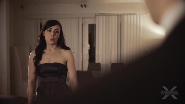 Brunette in strapless black dress at MissaX The Auction Teaser