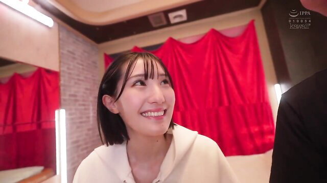 Smiling Japanese JAV girl in hoodie looks up closeup, CAWD-852