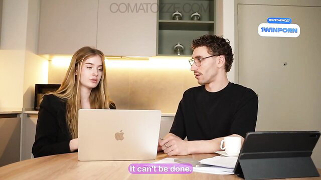Gorgeous blonde teen with man in kitchen on laptops, mind-boggling scene