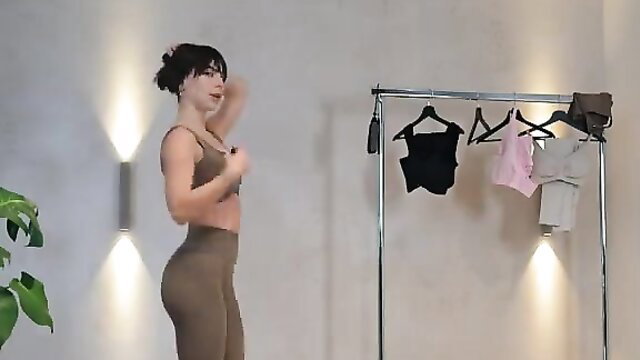 Fit brunette model tries on tight activewear, showing off curves