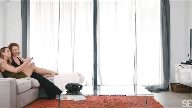 Cherry Candle and redhead lover cuddling intimately on couch in lingerie