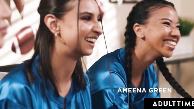 Ameena Green and brunette cheerleader smile in shiny blue satin tops