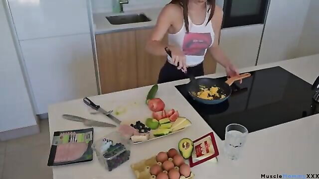 Fit Asian babe in crop top cooking eggs, toned abs and glutes