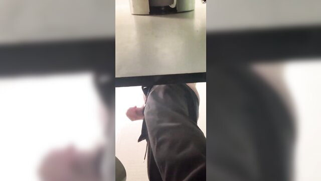Amateur flagra closeup of hard cock handjob under table