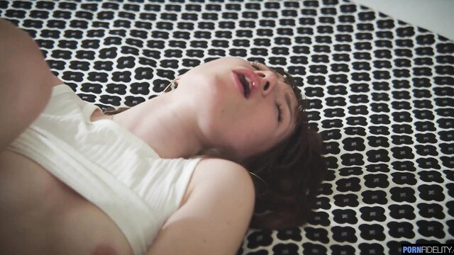 Asian girl Nick Ross topless ecstasy face on black patterned mat