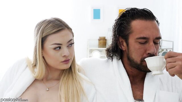 Amber Moore in robe teases with man sipping tea on Passion HD