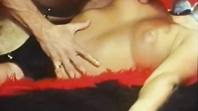 Vintage hardcore closeup man groping woman's large bare tits