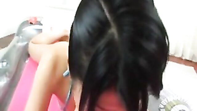 Japanese woman teasing on pink floatie, ass up pussy closeup