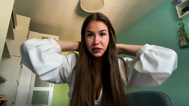 Leslifairey shy 18yo teen camgirl in blouse, hands on neck