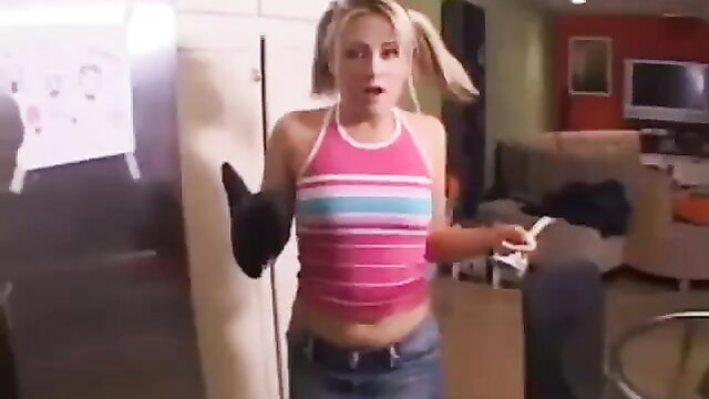 Blonde psycho babysitter in pink tank top and low jeans shocked expression
