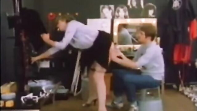 Retro blonde bending over in short skirt, sexy studio service tease