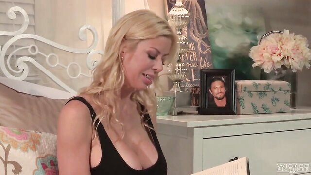 Busty blonde MILF Alexis Fawx in skimpy black dress on bed