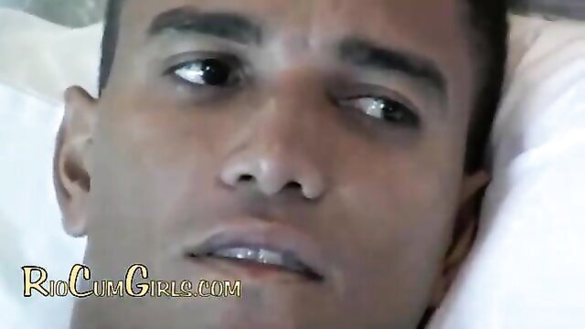 Closeup of handsome Black man with intense gaze in sex-positive Rio cumshot scene