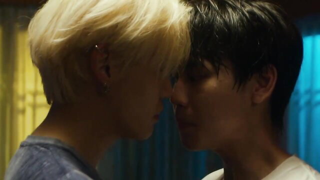 Two handsome Asian boys in intense close-up face touch, BL passion