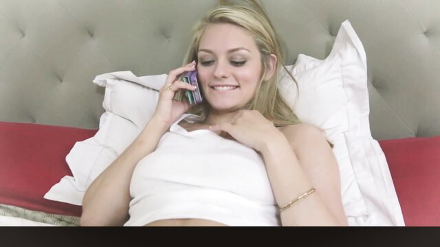 Blonde Alli Rae smiling on phone in bed, topless pregnant tease