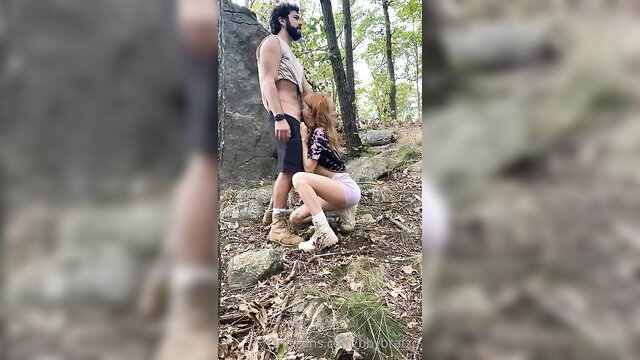 Zoey Luna kneels sucking boyfriend outdoors in woods