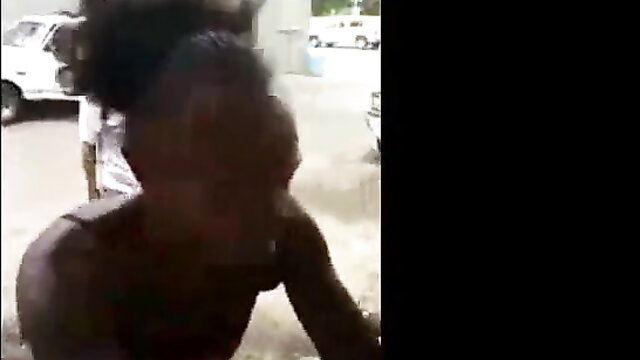 Fallen African woman exposes private parts outdoors