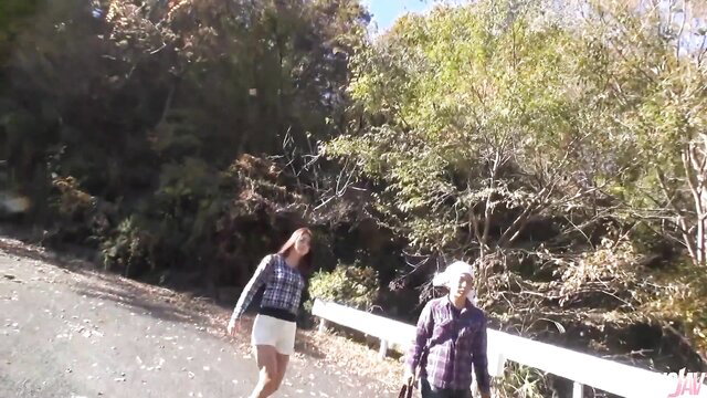 Maki Hojo Asian MILF in shorts and plaid shirt walks outdoors with man