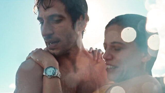 Carmen Machi topless hugging hunk on honeymoon beach