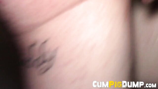 Blurry closeup of cum-covered skin with faint tattoo on hip