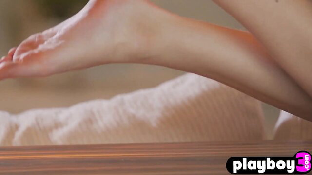 Stunning all natural babe posed naked showing soles and legs