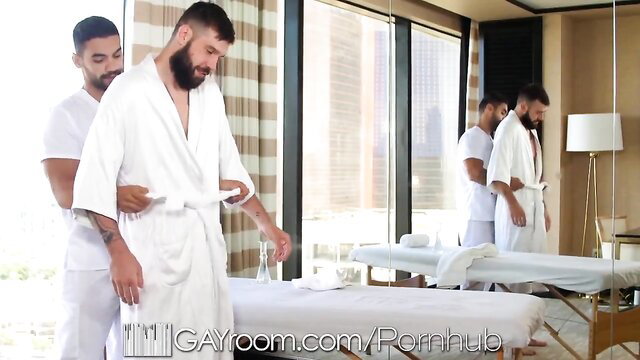 Arad Winwin massages Buck Richards in robe at GayRoom