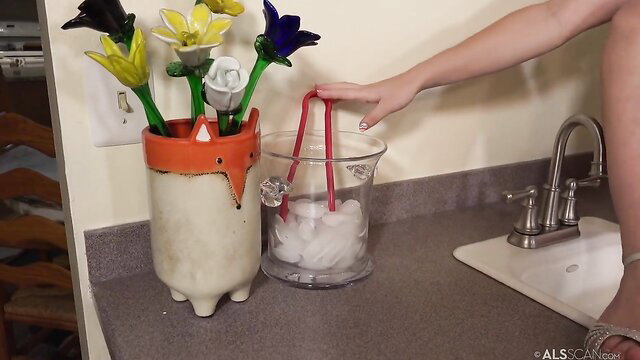 Juniper Ren grabs ice from bucket in hot bimbo piss porn scene