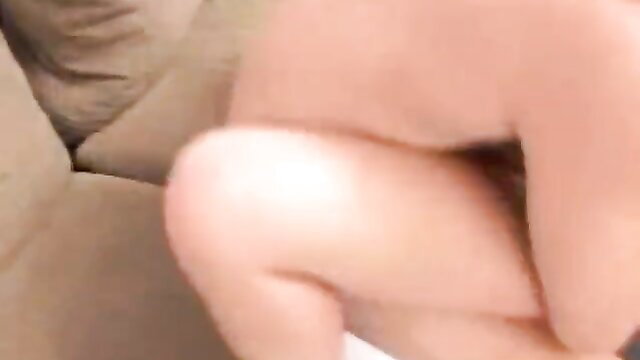 Busty brunette fingering pussy while fucked wildly on couch