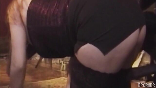 Lustful lesbian in torn black dress exposing pale ass in BDSM tease