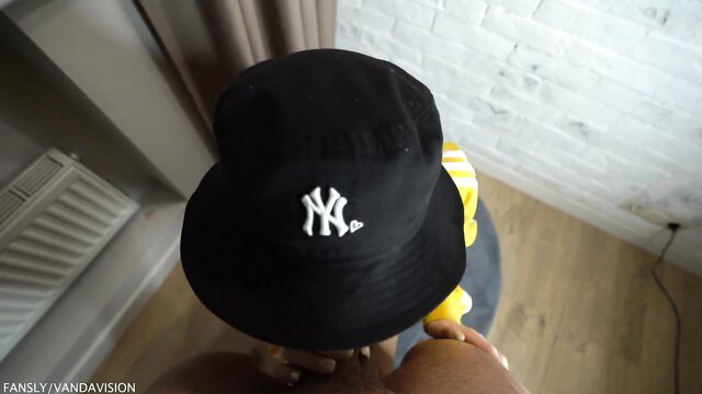 POV closeup of black bucket hat girl in yellow top teasing viewer