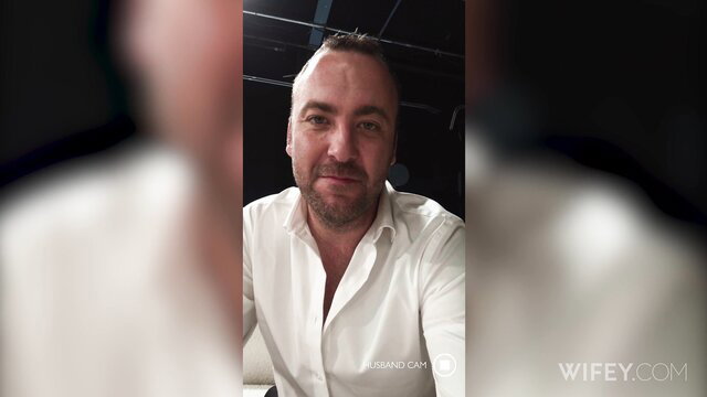 Mature bald man smiling in white shirt on adult cam