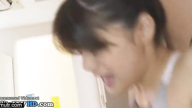 Japanese 18yo babe with black hair smiling in JAV sex scene