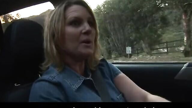 Blonde MILF driving car on farm road in lesbian porn thumbnail