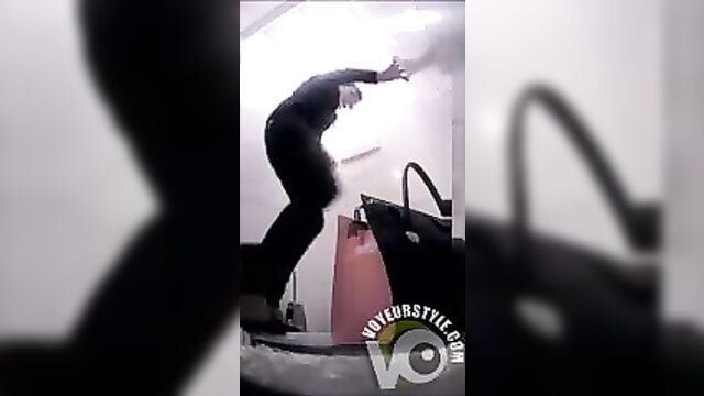 Hidden cam catches woman peeing in public toilet stall