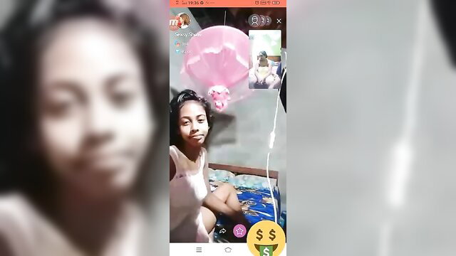 Young Sri Lankan beauty in tight tank top on live video call with balloons