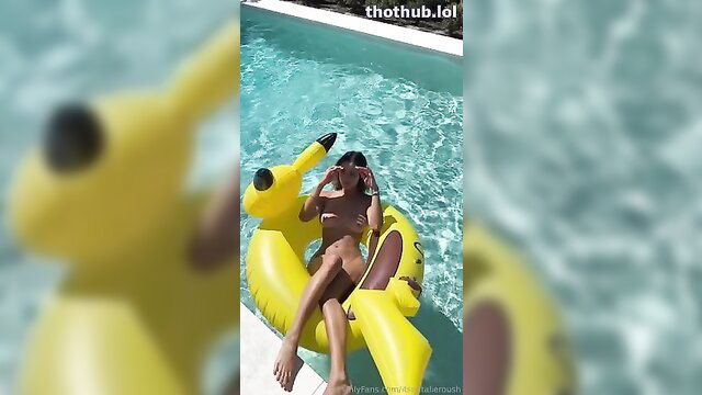 Natalie Roush naked on Pikachu floatie in pool