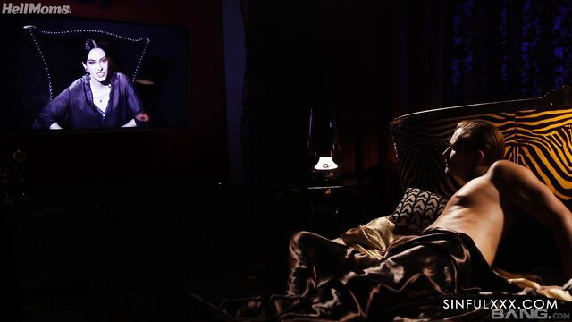 Blonde MILF Lucette Nice watches TV in lingerie on zebra sofa