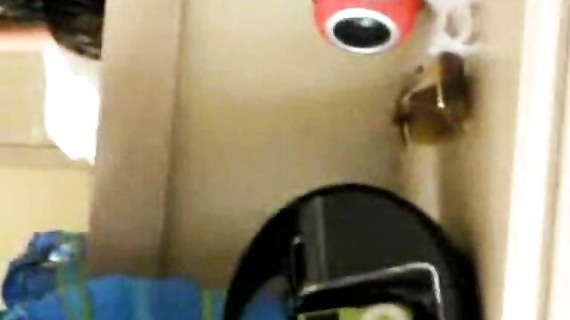 Elizabeth Jolie in amateur setup with red toy, black helmet, bag nearby