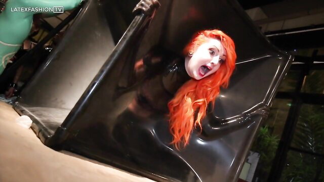 Sarah Kavaii in tight latex bondage vacbed on rubbercult