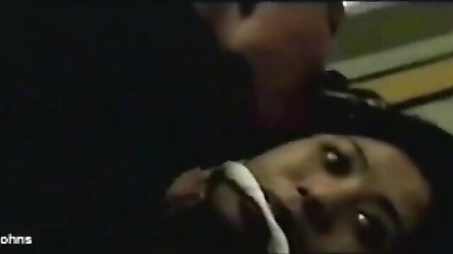 Asian woman bound and gagged by man in intense bondage scene