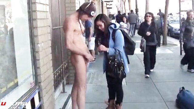 Asian girl fits cockring on naked guy dick in public street