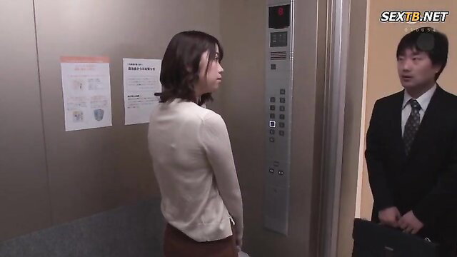 Japanese office lady in elevator with suited man, JAV tease
