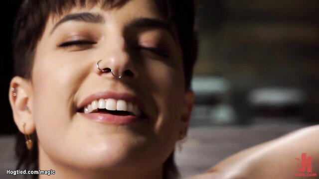 Kristen Scott smiling closeup, short dark hair, nose ring in adult video