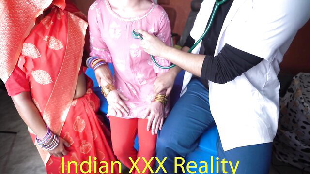 Indian doctor checks young girl's heart with stethoscope in exam