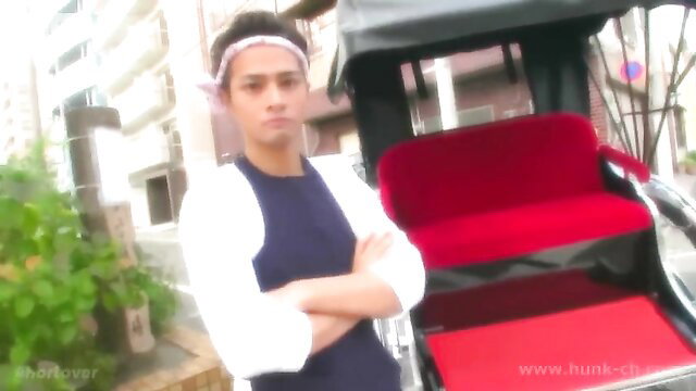 Rickshaw man Uesugi Daigo stands arms crossed by red cart