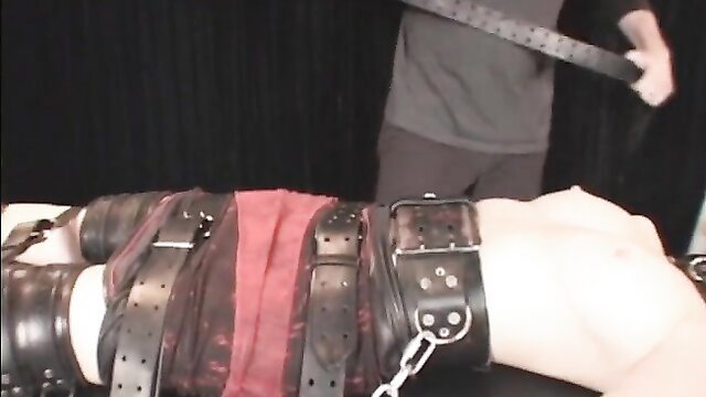 Bound BDSM slave gagged, strapped down for intense cunt torture