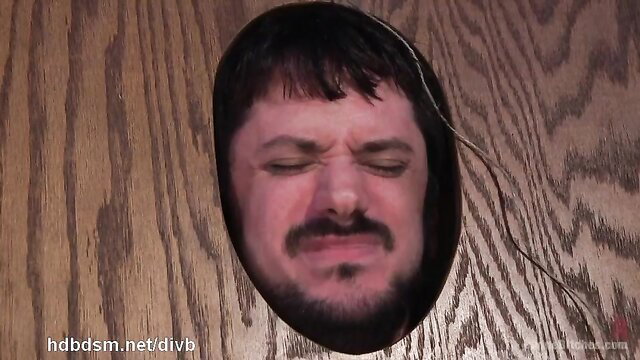 Man's face in glory hole wall, submissive stud for blonde mistress