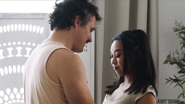 Kimmy Kimm gazes up at stepdad in tank top, intimate bedroom tease